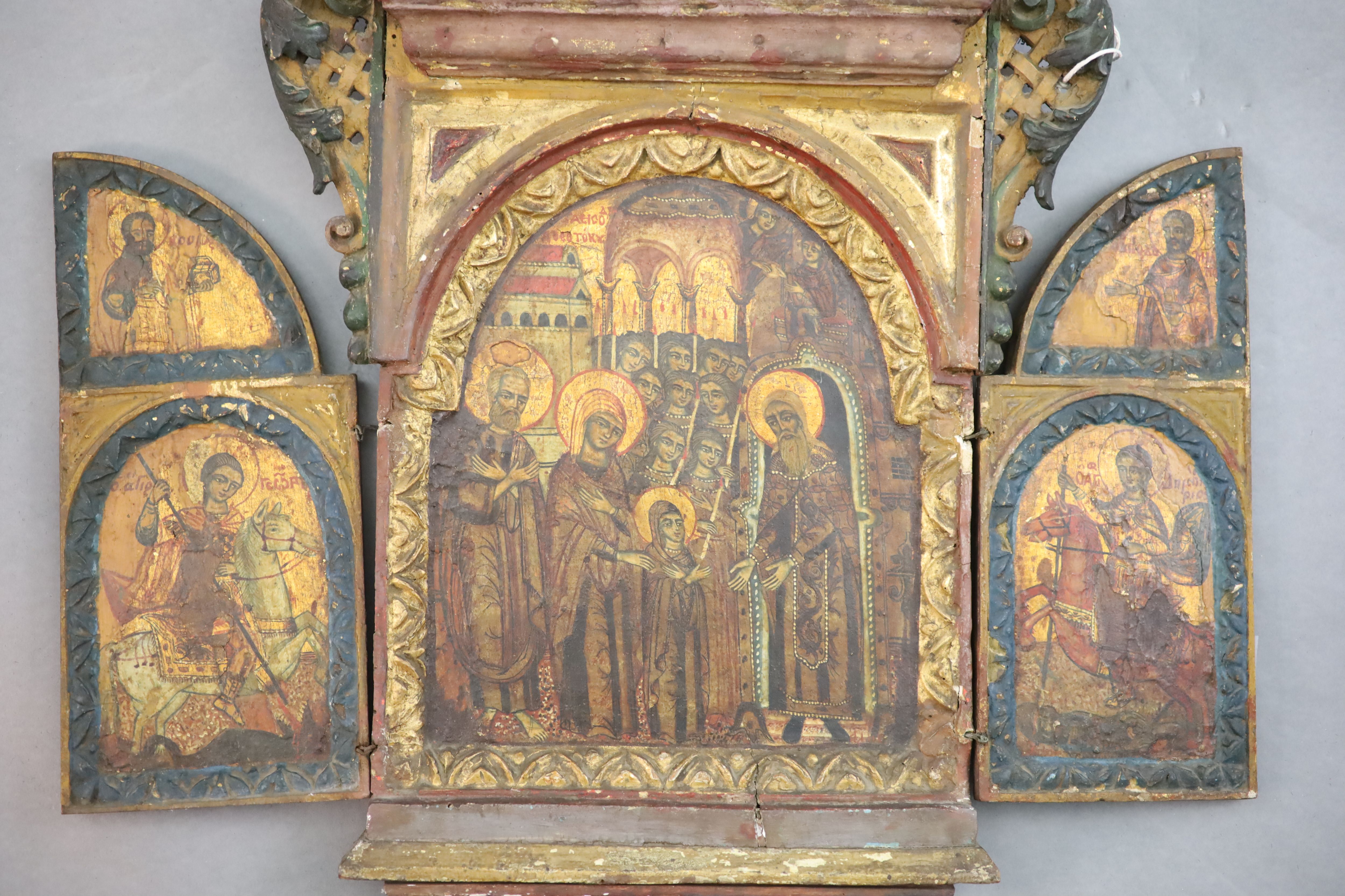 A 19th century Russian tempera on wood triptych icon, c.1800 25.5 x 16.5in. opens to 23.75in.